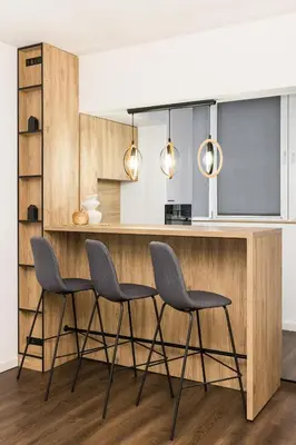a kitchen with two chairs and a bar with a counter at AGIA 3-comfort apartment Sofia in Sofia