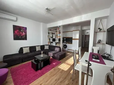 a living room with a couch and a table at Cozy Stay Sofia Historic Center in Sofia