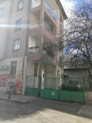 a building with a green gate in front of it at Cozy Stay Sofia Historic Center in Sofia