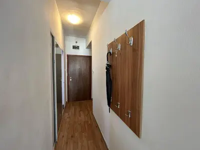 a hallway with wooden cupboards and a hallway with a hallway at Cozy Stay Sofia Historic Center in Sofia