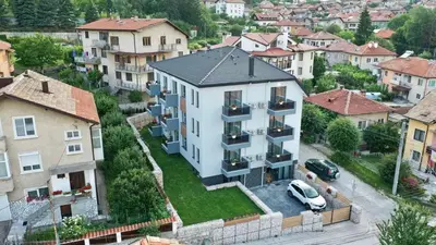 an aerial view of a building in a city at Апартамент с люлка и гледка в The House с Термална зона in Velingrad