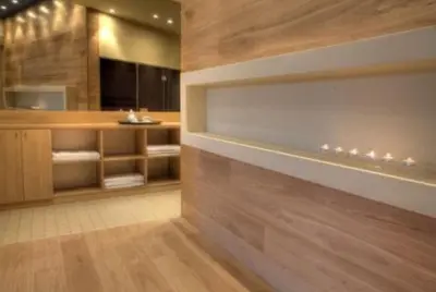 a bathroom with wooden walls and wooden floors at Alpine Charm Borovets Apart in Borovets