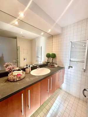 a bathroom with a sink and a mirror at Alpine Charm Borovets Apart in Borovets