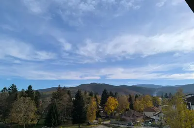 a view of the mountains with trees and houses at Апартамент Славяна in Velingrad