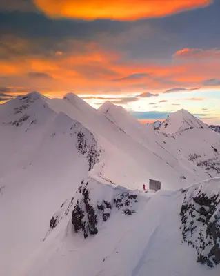 a snowy mountain with a person standing on top of it at Bansko Royal Towers apartment Star in Bansko