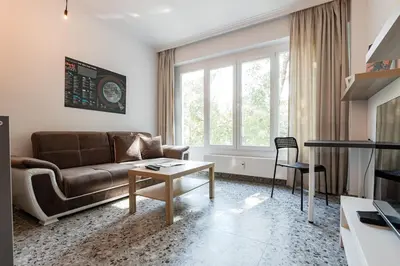 a living room with a couch and a table at Space art apart in Sofia