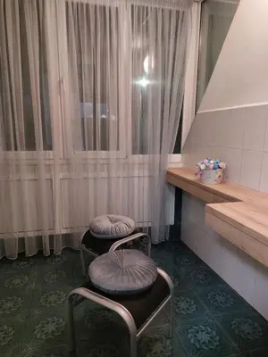 two stools with purple pillows sitting in a room at Tsvetanov Apartment in Blagoevgrad