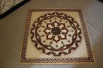 a rug with a flower pattern on a floor at Guest House Veni in Blagoevgrad