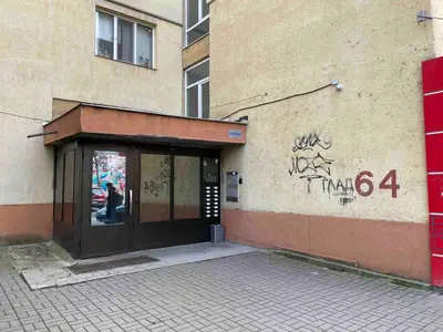 a entrance to a building with graffiti on it at Magnolia city view studio in Sofia