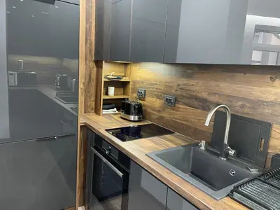 a kitchen with a sink and a counter top at Flat Park Sandanski in Sandanski