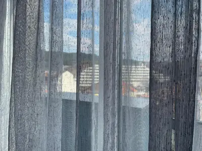 a view of a window with rain soaked curtains at Flat Park Sandanski in Sandanski