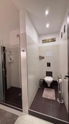 a bathroom with a shower and a toilet at Stylish 2 BR apart in top center in Sofia