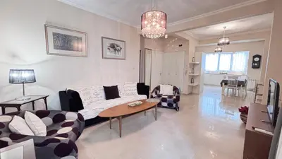 a living room with a couch and a table at Stylish 2 BR apart in top center in Sofia