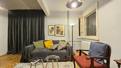 a living room with a couch and a chair at Colorful 2BD Apartment next to Serdika Center by Flat Mаnager in Sofia