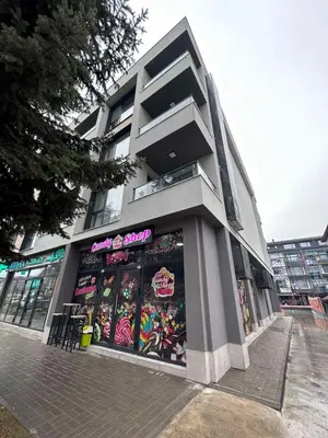 a building with graffiti on the side of it at July apartaments in Velingrad