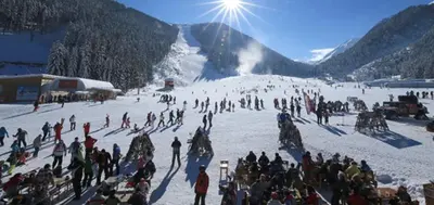 a group of people standing in the snow on a ski slope at Maisonette Mountain View - Euphoria Resort in Borovets