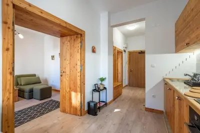 a kitchen and living room with a couch in a room at A central retreat in the heart of Sofia in Sofia