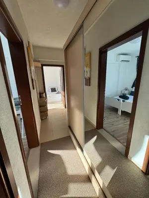 a room with a mirror and a hallway with a bedroom at Апартамент Слънчев дом in Smolyan