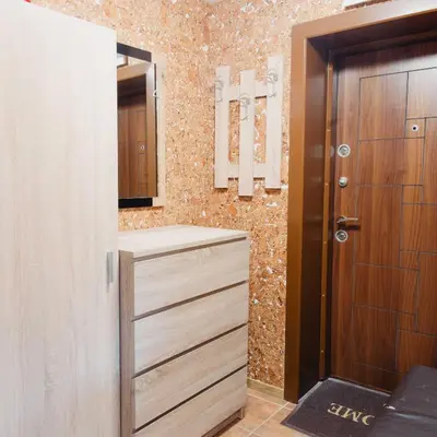 a bathroom with a closet with a wooden door at Pirin Peaks Residence - next to Ski Lift in Bansko
