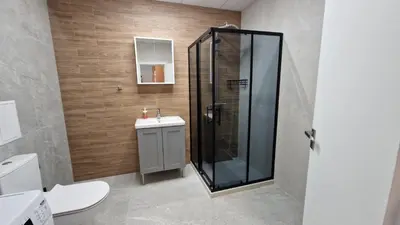 a bathroom with a shower and a sink at Cosy n fully equipped studio in Samokov