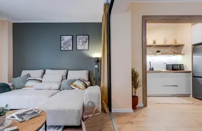 a living room with a couch and a table at Veslets 4 Oldtown Stay in Sofia
