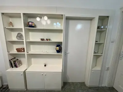a white closet with white shelves in a room at Florence family 2BDR Apt - min from Serdika w WiFi in Sofia