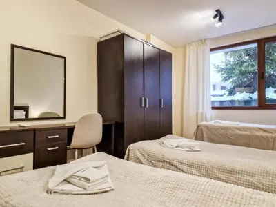 a hotel room with two beds and a mirror at Relaxing Stay in Kosara Bansko Near Ski Lift by Flat Mаnager in Bansko