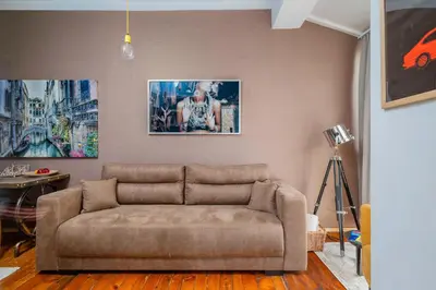 a living room with a couch in a room at Cozy and Central 2BD Flat - At the Heart of It All by Flat Mаnager in Sofia