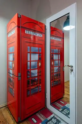 two red phone booths in a room with a mirror at Cozy and Central 2BD Flat - At the Heart of It All by Flat Mаnager in Sofia