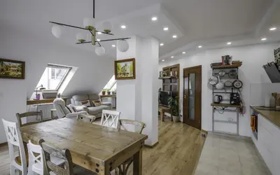 a dining room and living room with a table and chairs at Charming & Cozy 2BD Apartment with Natural Light by Flat Mаnager in Sofia