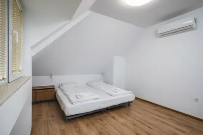 a small white room with a bed in it at Charming & Cozy 2BD Apartment with Natural Light by Flat Mаnager in Sofia
