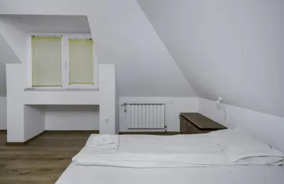 a white room with a bed and a window at Charming & Cozy 2BD Apartment with Natural Light by Flat Mаnager in Sofia