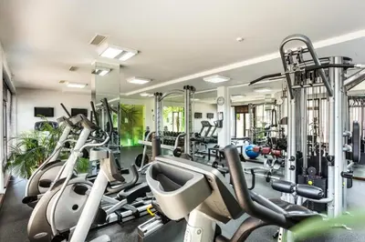 a gym with several treadmills and cardio machines at Bansko lodge 500m from ski lift in Bansko