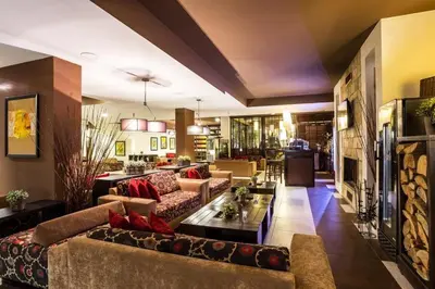 a living room with couches and a table at Bansko lodge 500m from ski lift in Bansko
