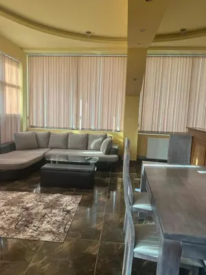 a living room with a couch and a table at arartment in Kostandovo