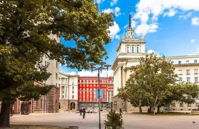 a group of buildings in a city with a tower at Center Stay Stylish 2BR near Serdika Metro in Sofia