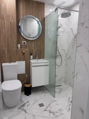 a bathroom with a toilet and a glass shower at Боко 16-18 in Sofia