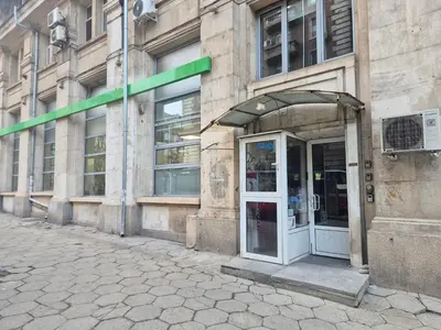 a building with an open door on a street at Боко 16-18 in Sofia