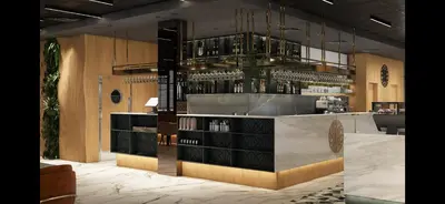 a bar in a restaurant with a counter with wine bottles at Pana Green Residence in Panagyurishte