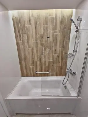 a bathroom with a shower with a tub at The View Sofia in Sofia