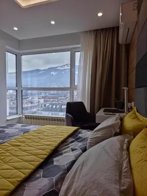 a hotel room with a bed and a large window at The View Sofia in Sofia