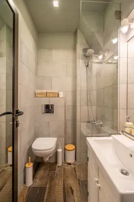 a bathroom with a toilet and a sink at Stylish 2 BDRM Apt at NDK in Sofia