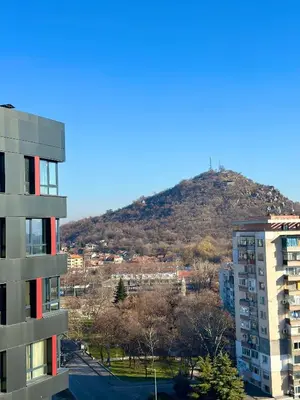 a view of a mountain from a building at West Point Luxury studio in Plovdiv