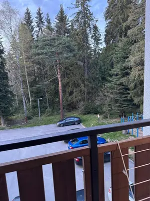 a car driving down a road on a bridge at Borovetz Gardens MVS Apart E28 in Borovets
