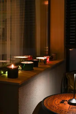 a counter with lit candles on top of a table at All Seasons Apartment in Sofia
