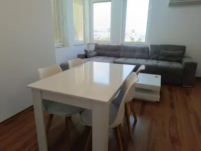 a white table and chairs in a living room at Two-bedroom Apartment Lauta 28 in Plovdiv