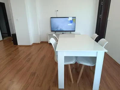 a white desk with chairs and a computer monitor at Two-bedroom Apartment Lauta 28 in Plovdiv