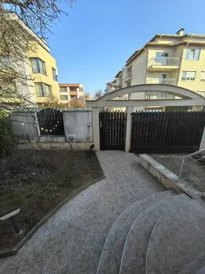 a courtyard with a fence and a building at Apartment Tinka in Sofia