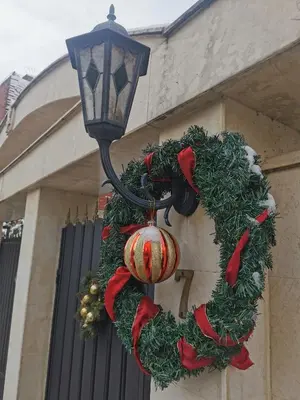 a christmas wreath on the side of a street light at Apartment Tinka in Sofia