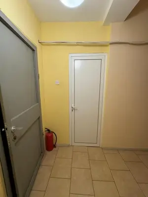 an empty room with a door and a tile floor at Cozy High-Street Loft in Sofia's Best Central Location in Sofia